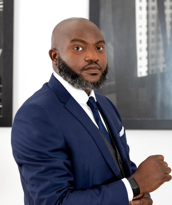 Dozy Mmobuosi stands at a podium and delivers a speech at Carnegie Hall